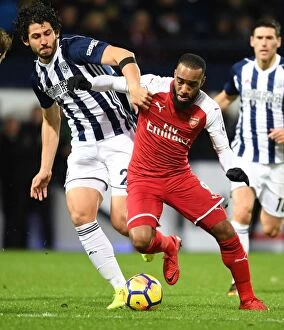 West Bromwich Albion v Arsenal 2017-18 Collection: Arsenal's Alex Lacazette Clashes with Ahmed Hegazi in Premier League Showdown