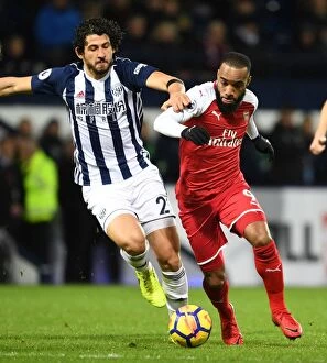 West Bromwich Albion v Arsenal 2017-18 Collection: Arsenal's Alex Lacazette Clashes with West Brom's Ahmed Hegazi in Premier League Showdown