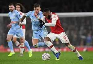 Arsenal's Alex Lacazette Outmaneuvers Leeds Ben White in FA Cup Clash
