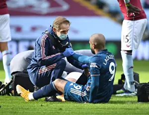 Arsenal's Alex Lacazette Receives Treatment from Physio during Aston Villa Match (Behind Closed Doors), 2021