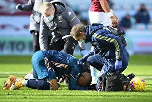 Arsenal's Alex Lacazette Receives Treatment from Physio in Empty Villa Park - Premier League 2020-21