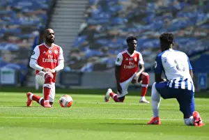Brighton And Hove Albion V Arsenal 2019-20 Prints: Arsenal's Alex Lacazette Takes a Knee at Empty Brighton Stadium - Premier League 2019-2020