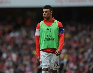 Arsenal v West Bromwich Albion 2014/15 Collection: Arsenal's Alex Oxlade-Chamberlain in Action During Premier League Clash Against West Bromwich
