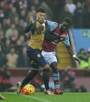 Aston Villa v Arsenal 2015-16 Collection: Arsenal's Alex Oxlade-Chamberlain Battles Idrissa Gana in Intense Premier League Showdown