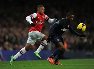 Arsenal's Alex Oxlade-Chamberlain Battles Manchester United's Patrice Evra