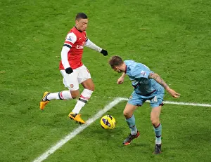 Arsenal V West Ham United 2012-13 Prints: Arsenal's Alex Oxlade-Chamberlain Charges Past West Ham's Matt Taylor