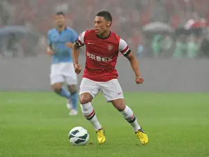 Arsenal's Alex Oxlade-Chamberlain Faces Manchester City in 2012 Pre-Season Clash at Bird's Nest Stadium, Beijing