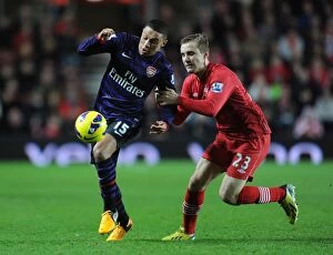 Images Dated 1st January 2013: Arsenal's Alex Oxlade-Chamberlain Faces Off Against Southampton's Luke Shaw in Premier League Clash