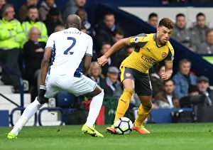 West Bromwich Albion V Arsenal 2016-17 Prints: Arsenal's Alex Oxlade-Chamberlain Faces Off Against Allan Nyom in Premier League Clash