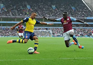 Arsenal's Alex Oxlade-Chamberlain Faces Off Against Aly Cissokho in Premier League Clash