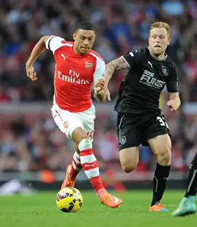 Arsenal's Alex Oxlade-Chamberlain Faces Off Against Burnley's Scott Arfield
