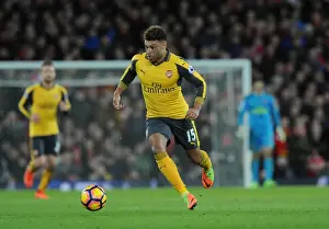 Liverpool V Arsenal 2016-17 Prints: Arsenal's Alex Oxlade-Chamberlain Faces Off Against Liverpool at Anfield (Premier League 2016-17)