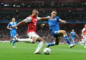 Arsenal V Olympiacos 2011-12 Prints: Arsenal's Alex Oxlade-Chamberlain Faces Off Against Olympiacos Joes Holebas in Champions League Clash