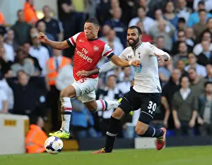 Tottenham Hotspur V Arsenal 2013-14 Prints: Arsenal's Alex Oxlade-Chamberlain Faces Off Against Tottenham's Sandro in Premier League Clash