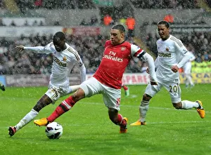 Swansea City V Arsenal 2012-13 Prints: Arsenal's Alex Oxlade-Chamberlain Fends Off Swansea's Nathan Dyer and Jonathan De Guzman