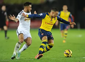 Arsenal's Alex Oxlade-Chamberlain Fends Off Swansea's Neil Taylor