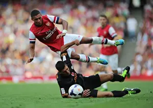 Arsenal V Galatasaray 2013-14 Prints: Arsenal's Alex Oxlade-Chamberlain Fouls by Galatasaray's Ceyhun Gulselam - Emirates Cup 2013