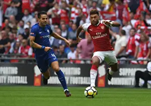 Arsenal V Chelsea - FA Community Shield 2017-18 Prints: Arsenal's Alex Oxlade-Chamberlain Outmaneuvers Chelsea's Cesc Fabregas in FA Community Shield Clash