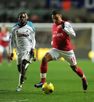 Swansea City V Arsenal 2011-12 Prints: Arsenal's Alex Oxlade-Chamberlain Outmaneuvers Swansea's Nathan Dyer