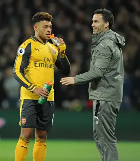 West Ham United V Arsenal 2016-17 Prints: Arsenal's Alex Oxlade-Chamberlain Training with Fitness Coach during West Ham United Match