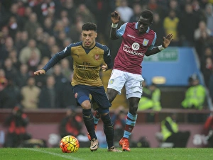 Arsenal's Alex Oxlade-Chamberlain vs. Aston Villa's Idrissa Gana: Intense Battle on the Premier League Field