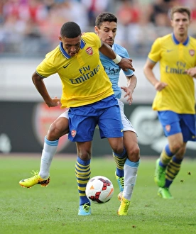 Arsenal V Manchester City Pre Season 2013-14 Prints: Arsenal's Alex Oxlade-Chamberlain vs