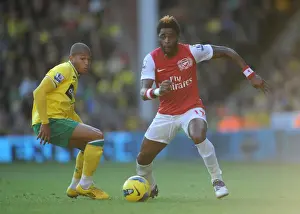 Norwich City V Arsenal 2011-12 Prints: Arsenal's Alex Song Clashes with Norwich's Simeon Jackson in Premier League Showdown at Carrow Road