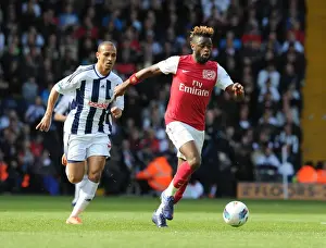 West Bromwich Albion V Arsenal 2011-12 Prints: Arsenal's Alex Song Outmaneuvers West Brom's Peter Odemwingie in 2011-12 Premier League Clash