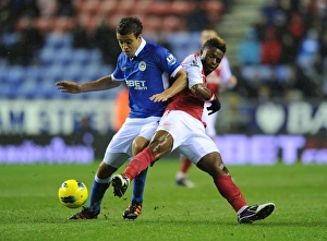 Wigan Athletic V Arsenal 2011-12 Prints: Arsenal's Alex Song Tackles Wigan's Franco Di Santo in Premier League Clash