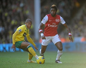 Norwich City V Arsenal 2011-12 Prints: Arsenal's Alex Song vs. Norwich's Simeon Jackson: Barclays Premier League Clash at Carrow Road (November 19)