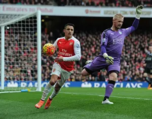 Arsenal V Leicester City 2015-16 Prints: Arsenal's Alexis Sanchez Battles Kasper Schmeichel for Possession in Intense Arsenal vs Leicester City Clash