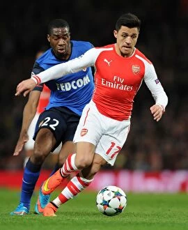 Images Dated 1st February 2009: Arsenal's Alexis Sanchez Clashes with Monaco's Geoffrey Kondogbia in UEFA Champions League Showdown