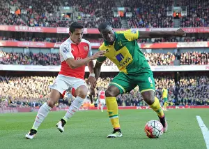Arsenal's Alexis Sanchez Closes In on Norwich's Sebastien Bassong during the 2015-16 Premier League Match