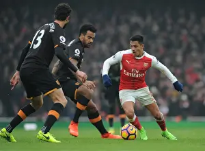 Arsenal's Alexis Sanchez Faces Off Against Hull City Defenders