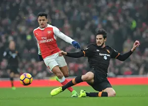Arsenal V Hull City 2016-17 Prints: Arsenal's Alexis Sanchez Faces Off Against Hull City's Andrea Ranocchia in Premier League Clash