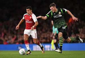 Arsenal V Doncaster Rovers - Carabao Cup 2017-18 Prints: Arsenal's Alexis Sanchez Faces Off Against Joe Wright in Carabao Cup Battle