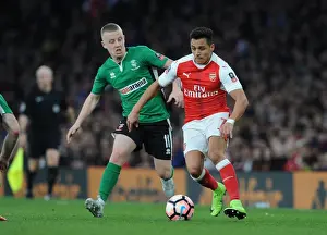 Arsenal V Lincoln City 2016-17 Prints: Arsenal's Alexis Sanchez Faces Off Against Lincoln's Terry Hawkridge in FA Cup Quarter-Final Showdown