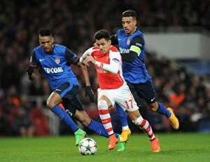 Images Dated 25th February 2015: Arsenal's Alexis Sanchez Faces Off Against Monaco's Nabil Dirar