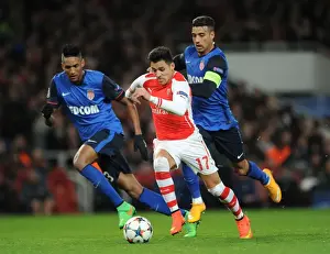 Arsenal V Monaco 2104/15 Prints: Arsenal's Alexis Sanchez Faces Off Against Monaco's Nabil Dirar