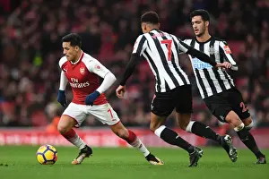 Arsenal V Newcastle United 2017-18 Prints: Arsenal's Alexis Sanchez Faces Off Against Newcastle's Mikel Merino