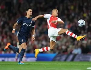 Arsenal's Alexis Sanchez Faces Off Against Southampton's Jose Fonte in League Cup Clash
