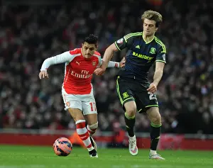 Arsenal V Middlesbrough - FA Cup 2014-15 Prints: Arsenal's Alexis Sanchez Fends Off Middlesbrough's Patrick Bamford in FA Cup Clash