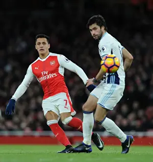 Arsenal's Alexis Sanchez Fends Off West Brom's Claudio Yacob
