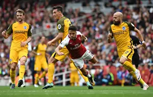 Arsenal V Brighton And Hove Albion 2017-18 Prints: Arsenal's Alexis Sanchez Fouls by Brighton's Lewis Dunk in Premier League Clash
