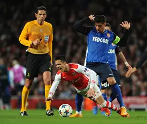 Arsenal V Monaco 2104/15 Prints: Arsenal's Alexis Sanchez Fouls by Monaco's Nabil Dirar in Champions League Clash