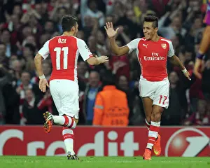 Arsenal's Alexis Sanchez and Mesut Ozil Celebrate Goals Against Galatasaray in 2014 Champions League Match
