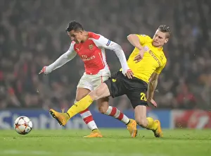 Arsenal V Borussia Dortmund 2014-15 Prints: Arsenal's Alexis Sanchez Outmaneuvers Borussia Dortmund's Lukas Piszczek in 2014-15 Champions League Clash
