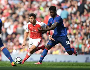Arsenal's Alexis Sanchez Outmaneuvers Manchester United's Axel Tuanzebe during the Premier League Clash