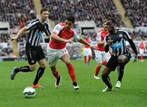 Newcastle United V Arseal 2014/15 Prints: Arsenal's Alexis Sanchez Outmaneuvers Newcastle's Defense in Premier League Clash