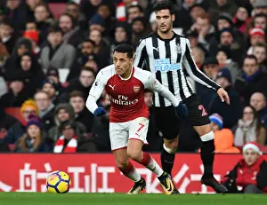 Arsenal V Newcastle United 2017-18 Prints: Arsenal's Alexis Sanchez Outmaneuvers Newcastle's Mikel Merino during Premier League Clash